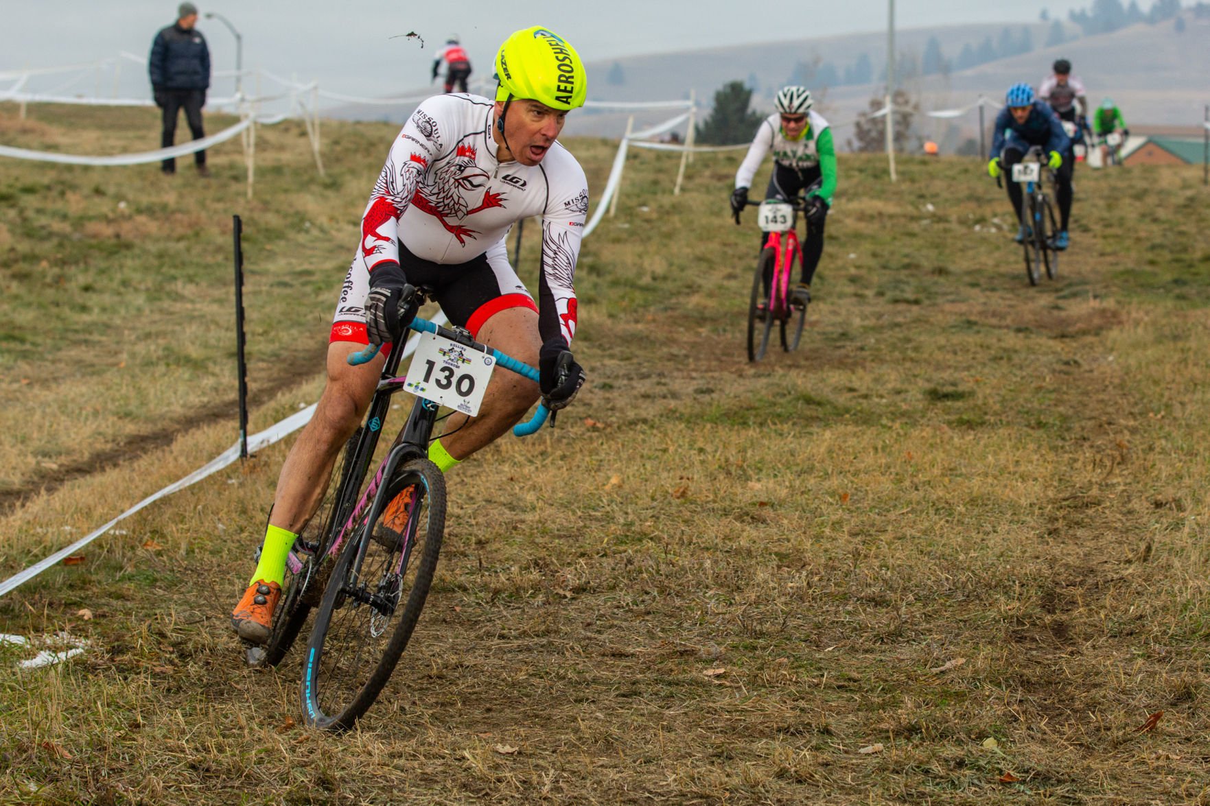Alex Gallego rounds a muddy corner